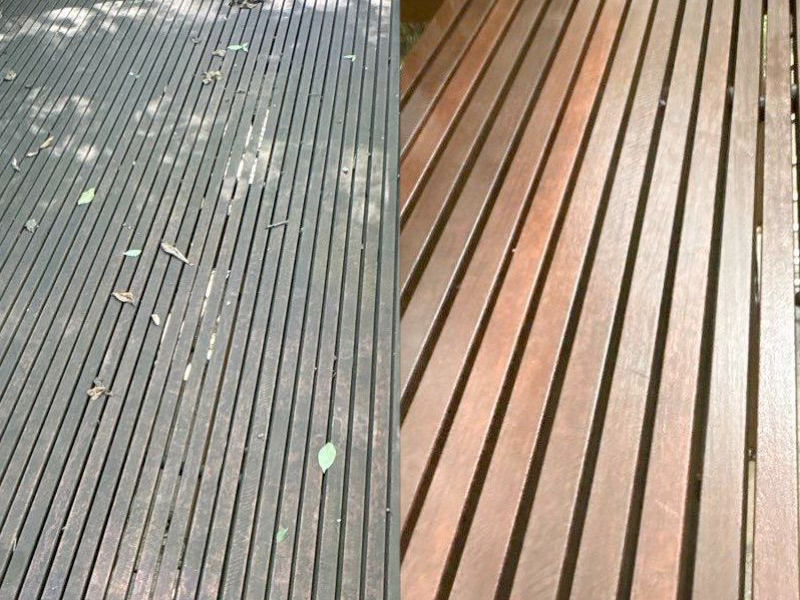 Side-by-side comparison of wooden planks: the left side shows dirty planks with leaves and debris, while the right side—clean and well-maintained—reveals the results of SUDS Power Washing.